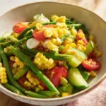 Thai Corn Cucumber Salad with spicy dressing and fresh vegetables